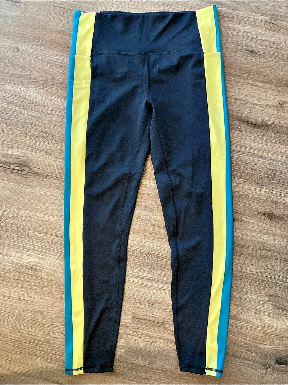 Senita Athletic Leggings in Black with Yellow, teal, and pink stripes
